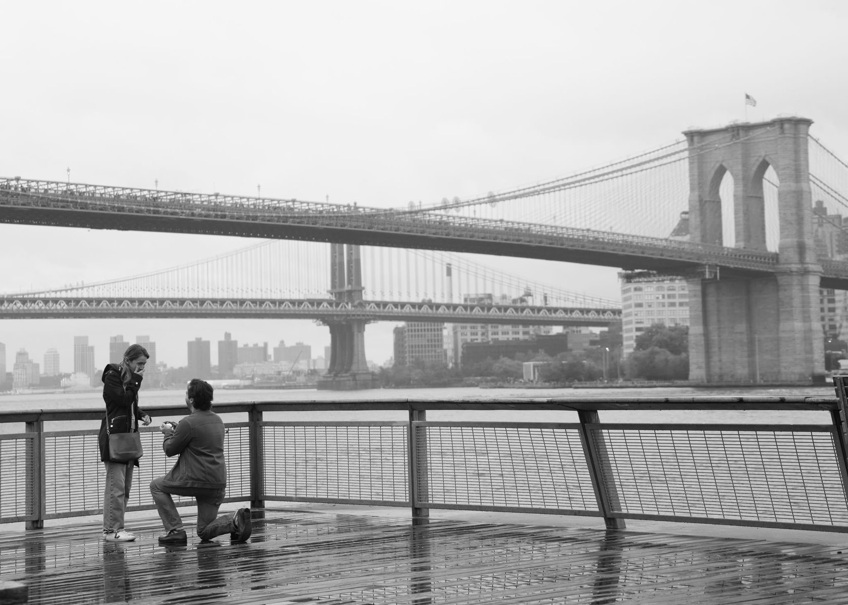 Matt proposing to Jenn by the Brooklyn Bridge